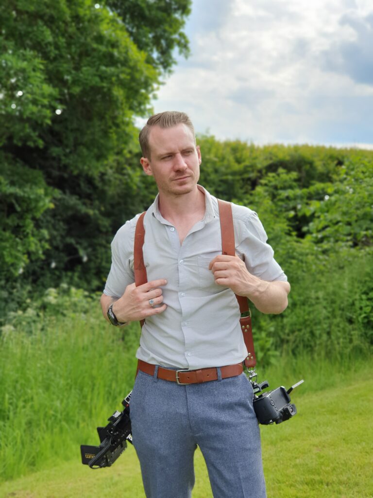 OWP Weddings with his cameras at a wedding